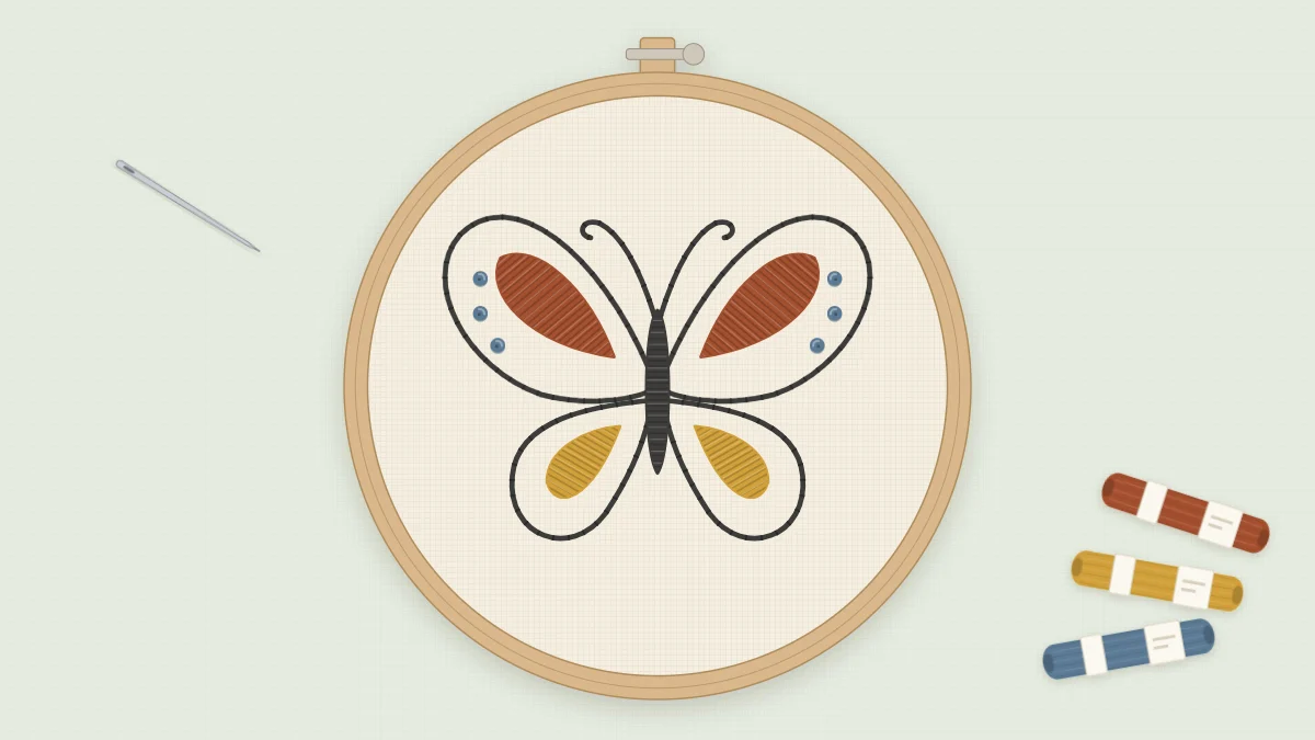 Finished embroidered butterfly in a 5-inch hoop on cream fabric with rust and mustard wing bands and slate blue knots