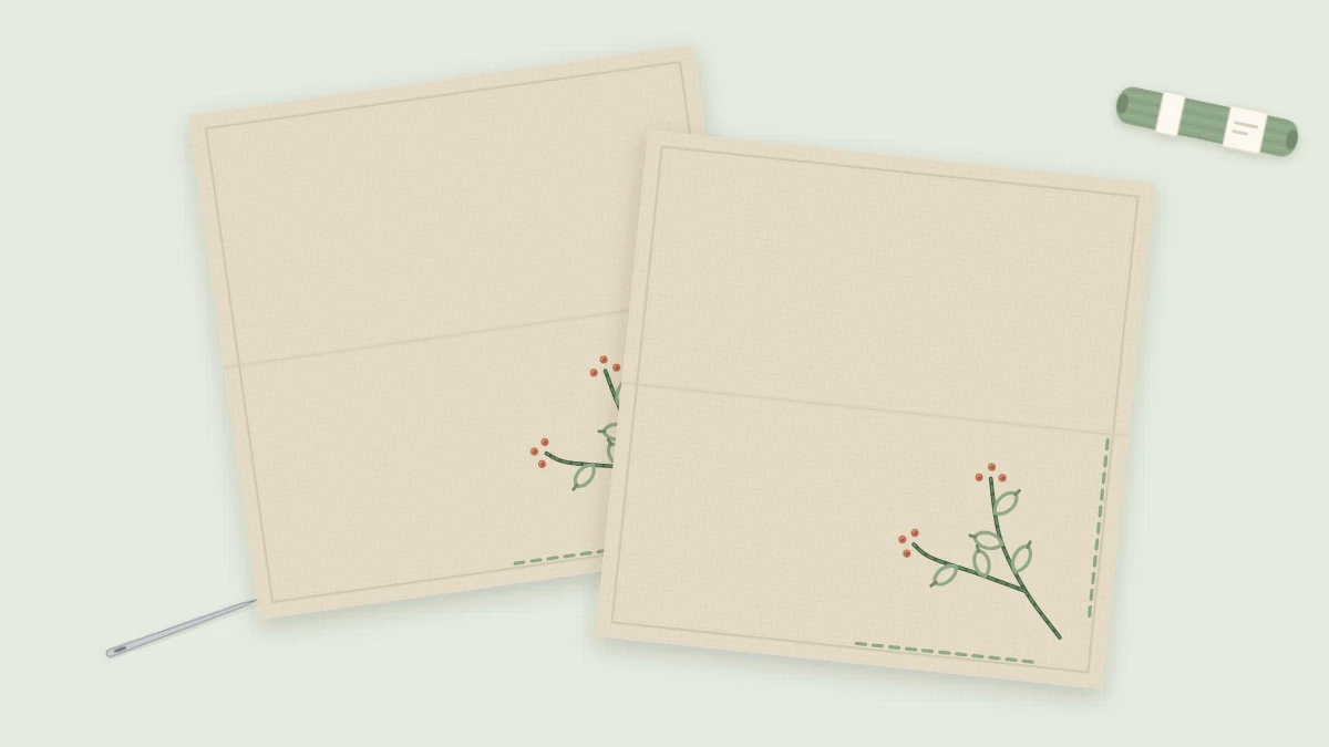 Two folded natural linen napkins, each with a small green sprig and terracotta berries embroidered in the corner